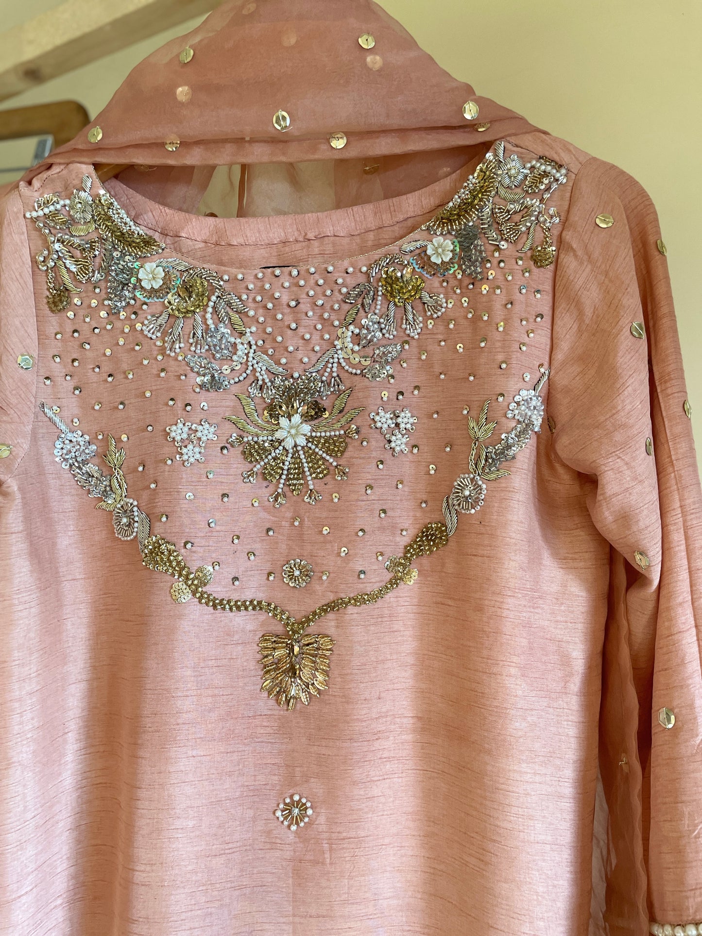 Elegant hand embroidered shirt paired with pant .